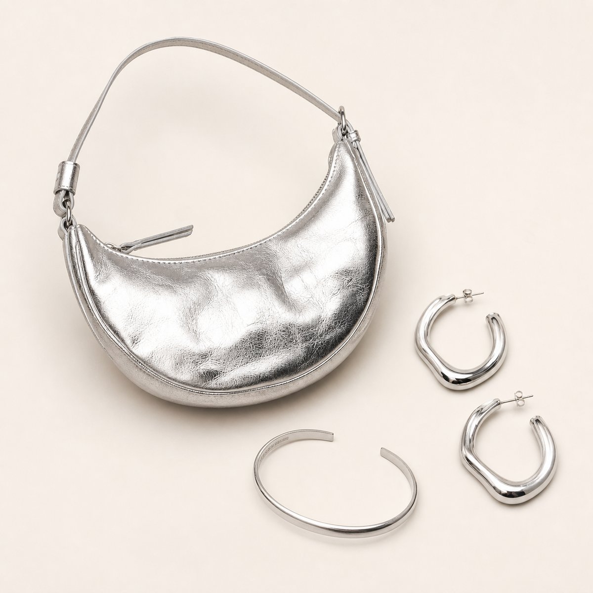 Synthetic silver handbag and jewellery